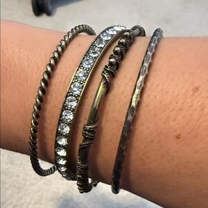 Set of 4 brass toned bangled stackable bracelets